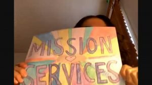 A hand-drawn sign that reads "Mission Services"